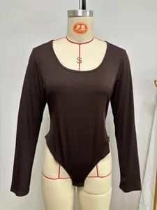 Detail view of a dark brown ribbed long-sleeve bodysuit shown on a professional mannequin