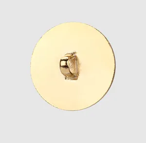 Detailed back view of a gold circular shank button with a smooth polished finish.