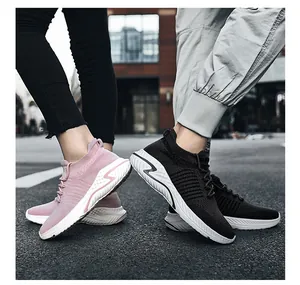 Pair of breathable fly-knit sneakers for couples shown in an urban street setting