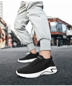 Close-up view of breathable black fly-knit slip-on sneakers for walking and sports