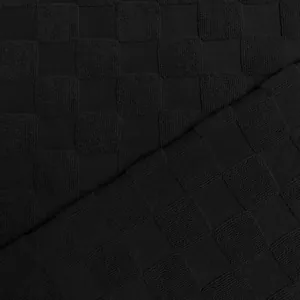 Vue détaillée du tissu en maille jacquard à damier noir pour t-shirt pour hommes