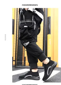 Baskets montantes noires en maille pour hommes avec semelle souple pour le sport décontracté