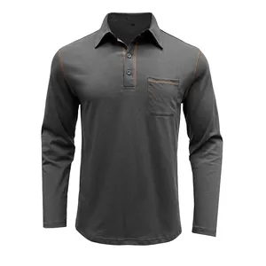 Vista frontal de polo de manga larga gris carbón con bolsillo y costuras