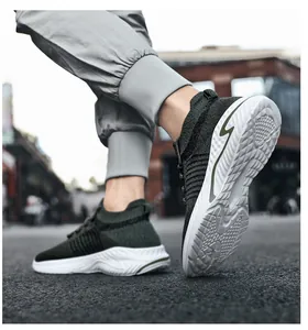 Close-up of green flyknit sneakers showing breathable upper and durable white sole