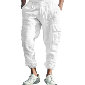 Detail view of white cotton linen cargo pants featuring drawstring waist and side pockets