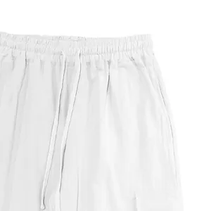 Detailed view of white cotton linen casual drawstring pants with elastic waistband