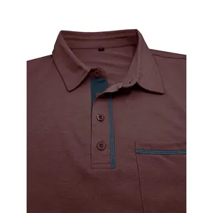 Detalle de polo de manga larga burdeos para hombre con cuello y bolsillo en el pecho