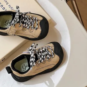 Beige suede toddler sneakers featuring checkered laces and soft rubber soles for autumn