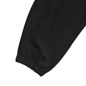 Close-up of elasticated ankle cuff on men's black linen cargo jogger pants
