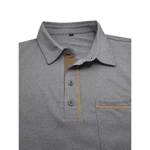 Primer plano de un polo gris de manga larga con costuras marrones en contraste en la tapeta