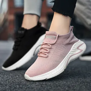 Breathable fly-knit couple sneakers in pink and black, lightweight sport shoes street view