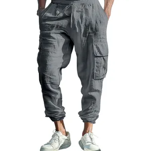 Close-up of men's loose cotton linen cargo pants with drawstring and side pockets