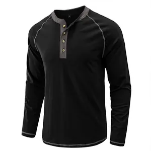 Close-up of black long sleeve Henley shirt with contrast grey trim and buttons.