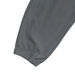 Close-up of elasticized cuff on grey cotton linen casual trousers