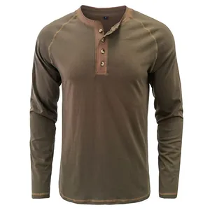 Macro detail of a men's vintage olive green heavy cotton long sleeve Henley shirt