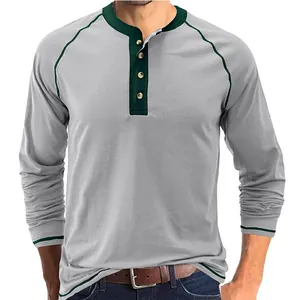 Close-up detail of a men's vintage grey and green heavy cotton long-sleeve Henley T-shirt