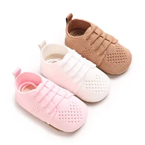 Detailed view of breathable knitted baby flat shoes in pink, white, and brown colors