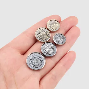 Premium metal coat of arms embossed buttons for high-end jacket and suit sets.