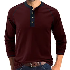 Detail shot of a men's vintage heavyweight cotton long sleeve Henley shirt in burgundy.