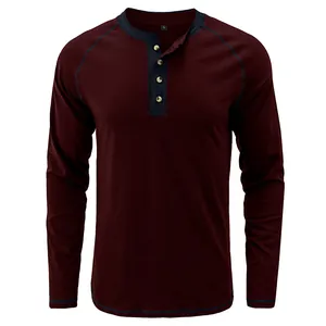 Front view of a vintage burgundy long-sleeved Henley shirt with navy blue contrast trim