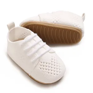 Detail of white hollow-out infant princess shoes showing the non-slip rubber sole.