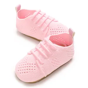 Detailed view of pink breathable knitted mesh baby flat shoes with decorative laces