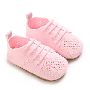 Close-up macro view of the pink hollow knit pattern on these baby princess flat shoes
