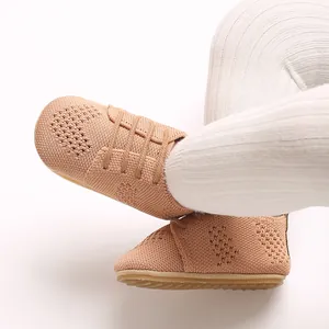 Close-up view of vintage knit baby princess shoes with hollow design and soft flat soles