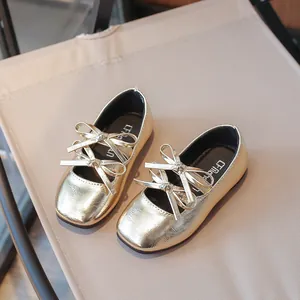 Elegant golden girls Mary Jane shoes featuring double bows and square toe design.