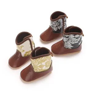 Detailed view of the elegant printed floral patterns on winter baby boots made from soft PU leather
