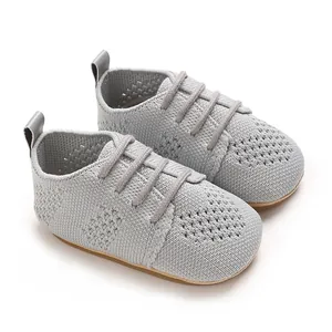 Close-up of grey breathable mesh baby walker shoes with soft non-slip soles for infants