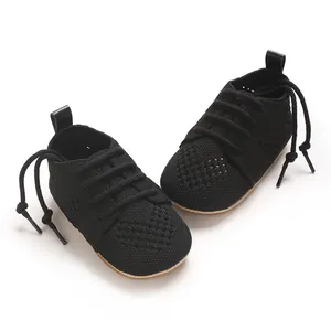 Detailed texture of black breathable mesh knit baby walking shoes for infants