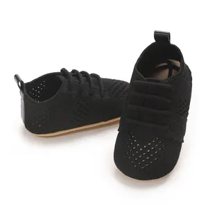 Close-up of breathable black knit baby walking shoes for infants aged 0-1 years.