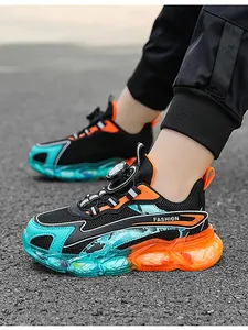 Side view of boys mesh running shoes featuring colorful bubble sole and rotating button lacing.