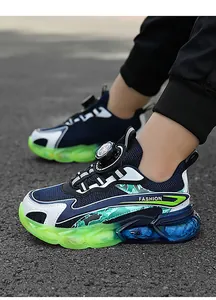 Boys' breathable mesh sneakers with dial closure and vibrant neon green sole detail