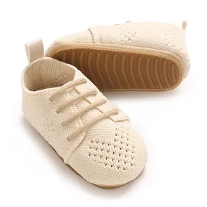 Detail showing the breathable mesh texture and anti-slip sole of the baby shoes