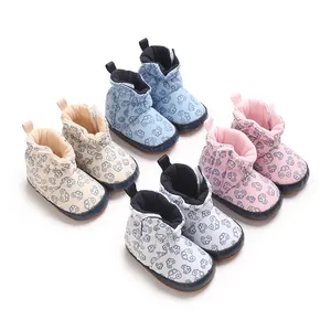 Detail view of soft cotton baby boots with cute cartoon car patterns in four colors.