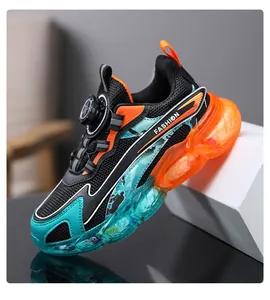 Detailed side view of boys' breathable mesh sneakers with teal and orange jelly soles.