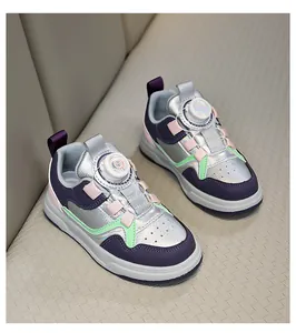 Detailed view of stylish kids' metallic silver sneakers with breathable rotary buckle closure