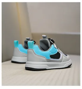 Children's breathable sports sneakers with rotary buckle closure in blue and grey