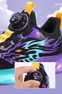 Detailed view of breathable mesh boys sneakers featuring a rotary dial lace closure system