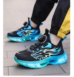 Detail view of boys breathable sports shoes with blue dragon pattern and rotating buckle