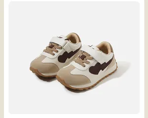 Toddler sneakers in cream and beige with dark brown heart pattern details for autumn
