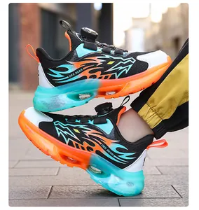 Detailed side view of boy's breathable mesh sneakers with flame pattern and air cushion.