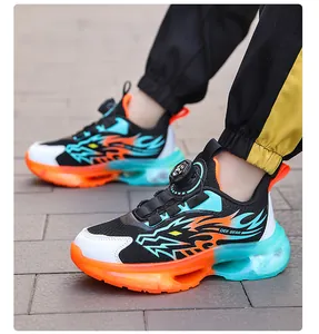 Detailed shot of boys vibrant mesh sneakers with a rotary buckle and dragon flame design