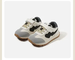 Side view of toddler autumn sports shoes in beige and grey featuring heart lightning graphic