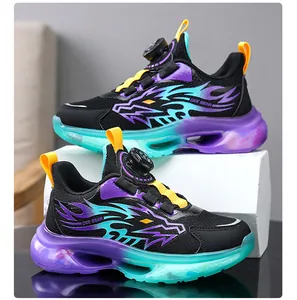 Side view of boy's breathable sports shoes with dragon pattern and dial lace system.