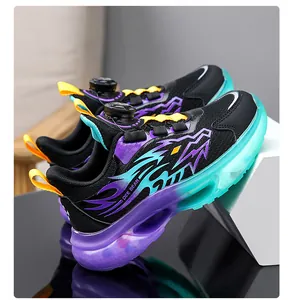 Boys athletic sneakers featuring breathable mesh and vibrant gradient sole detail