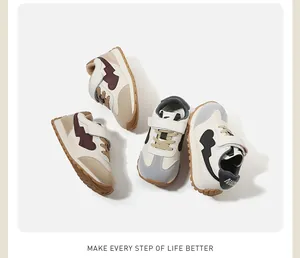 View of stylish toddler sneakers in beige and black color variants for autumn season