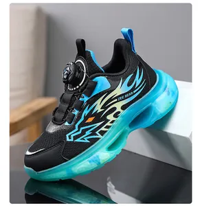 Side view of boys breathable sports shoes featuring a blue translucent sole and flame design